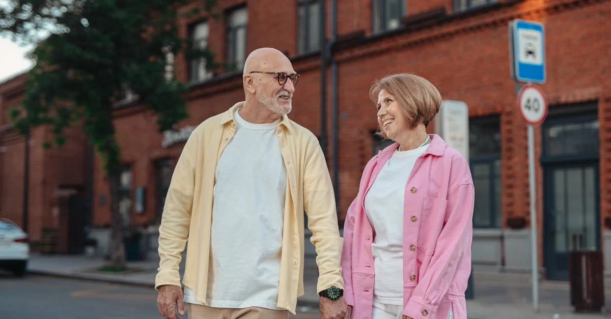 Smiling elderly couple holding hands, symbolizing security and planning for the future