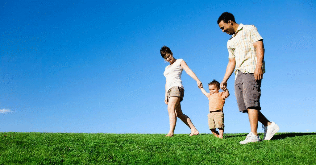 Happy family smiling together symbolizing the balance of healthcare and wealth